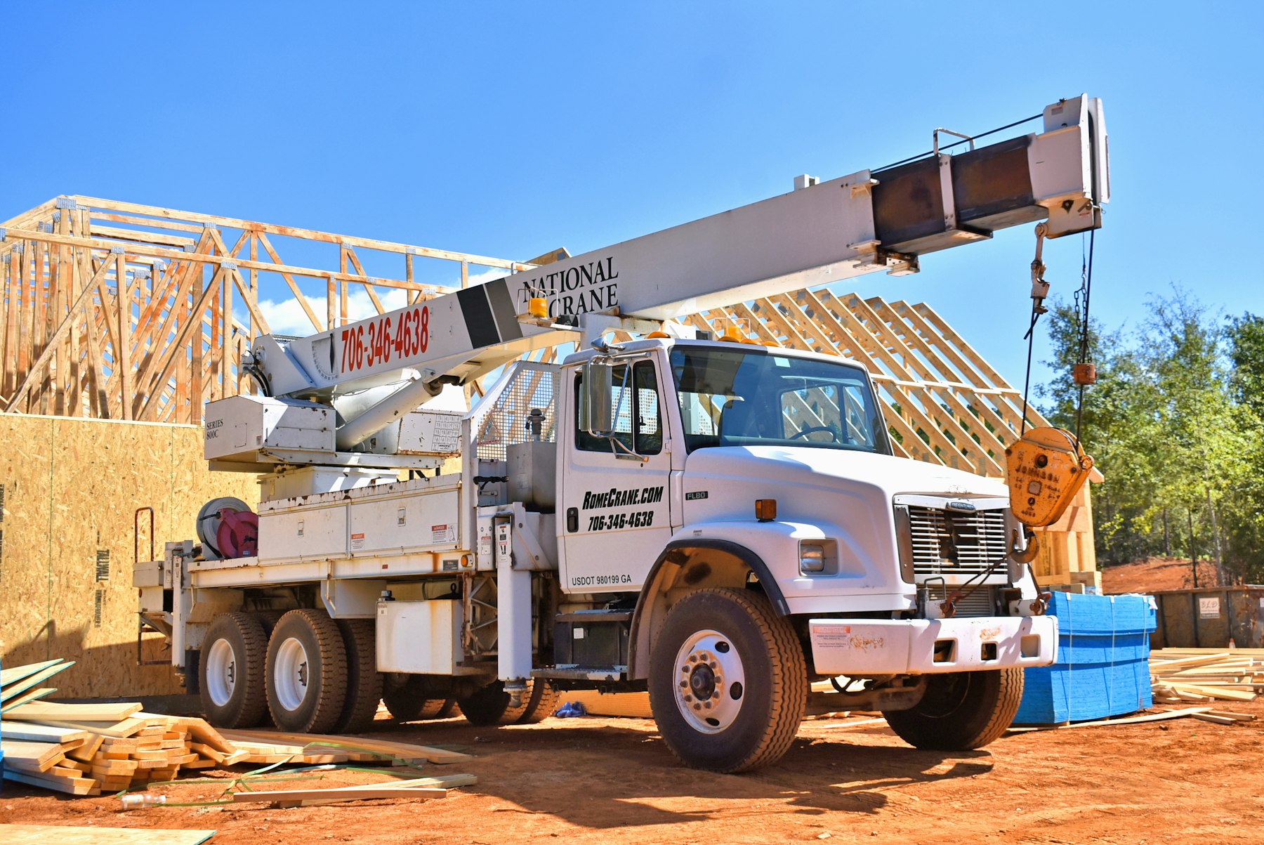 Boom truck crane at a construction site
