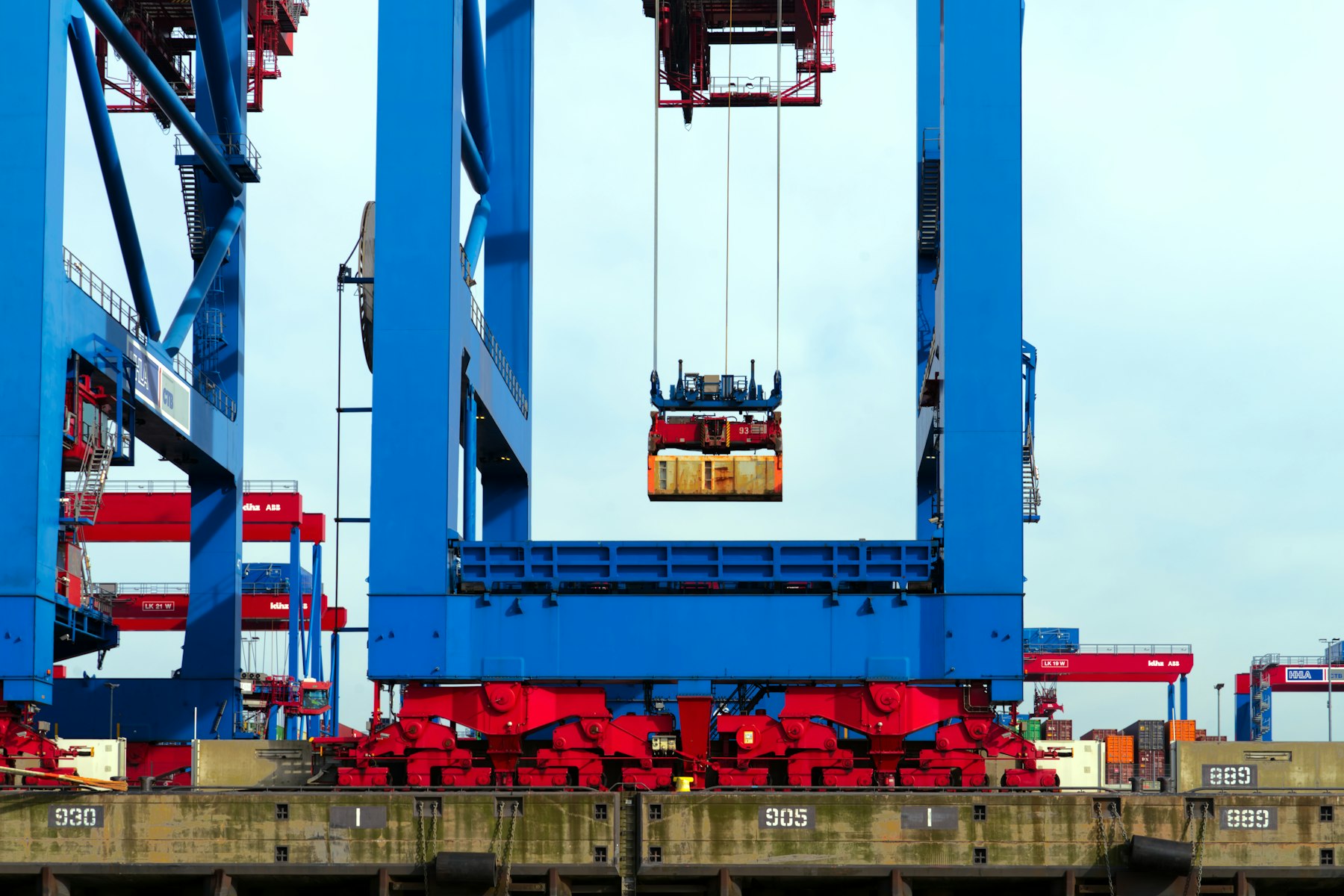 Container crane lifting a shipping container