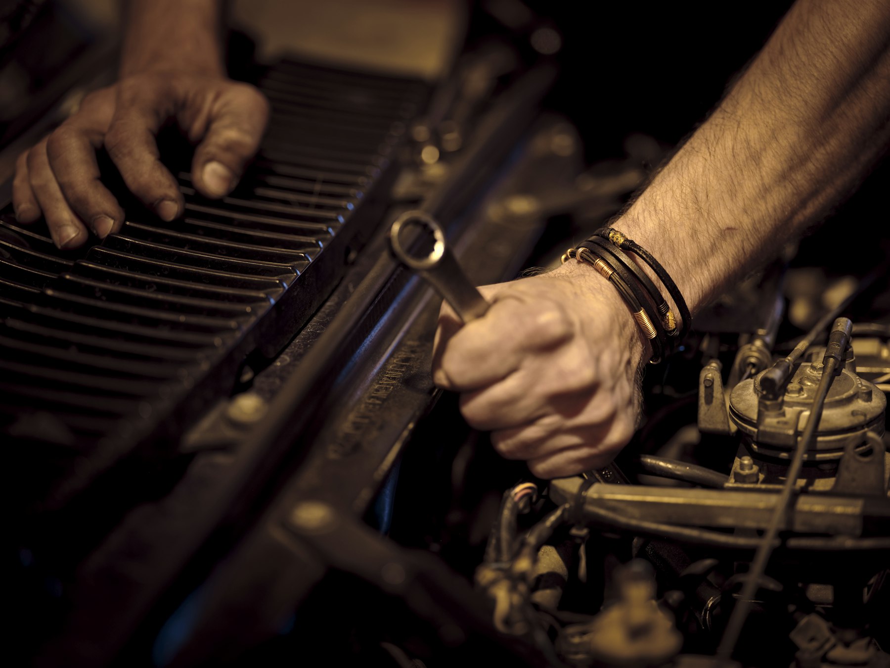 Mechanic hands working on an engine