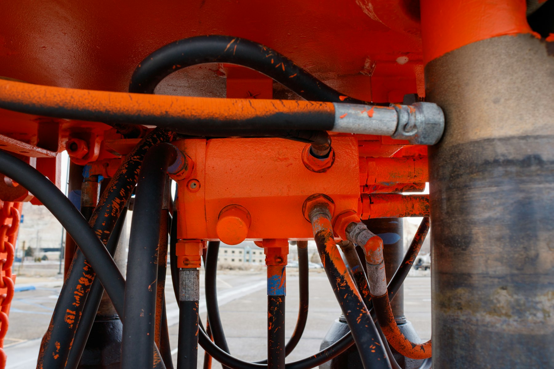 Hydraulic hoses and components on heavy machinery