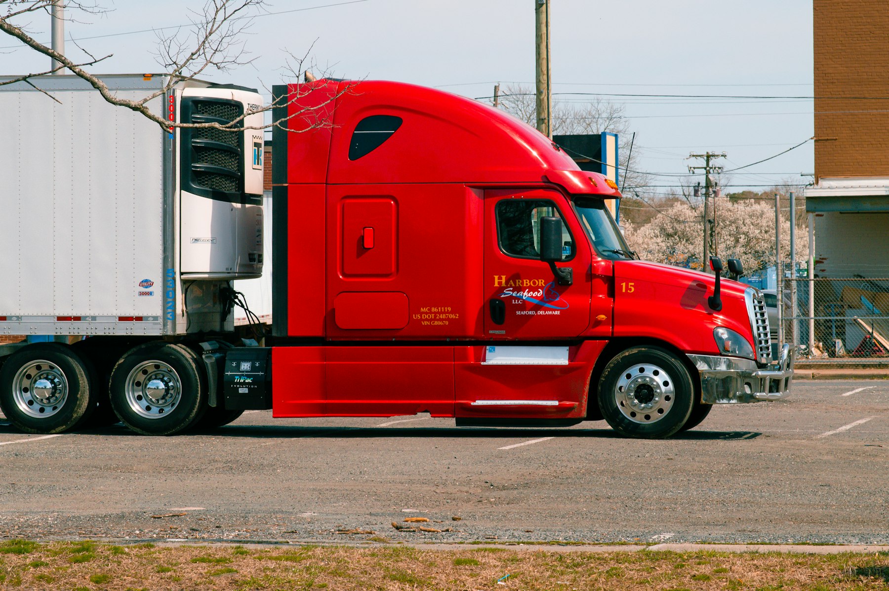 Red semi tractor trailer on the highway